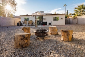 Enjoy the fire pit in the solid block fenced back yard! PLEASE NOTE: the backyard is shared with guests in the front part of the house.