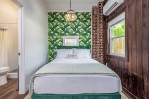 An entire view of the studio showing the bathroom on the left