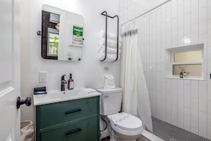 Walk-in shower with plush towels provided