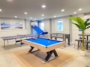 Large game room with new pool table, ping-pong, foosball, and new basketball game