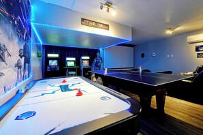 Game room with 125 inch theater, Xbox, and Nintendo Switch.