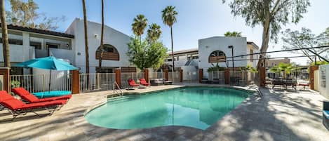 Remodeled Pool with designer travertine and newer furniture