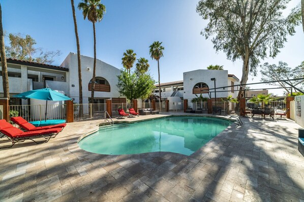 Remodeled Pool with designer travertine and newer furniture