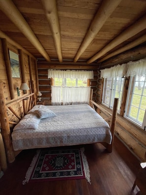 bedroom on first floor with queen bed and amazing view of Lake Michigan