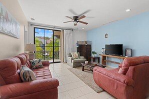 Comfortable living room with Smart TV and terrace access.  