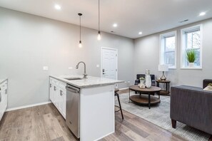 Living Room / Fully stocked kitchen