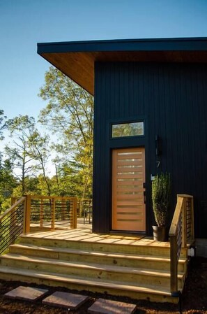 Front entrance leads to the expansive deck. 