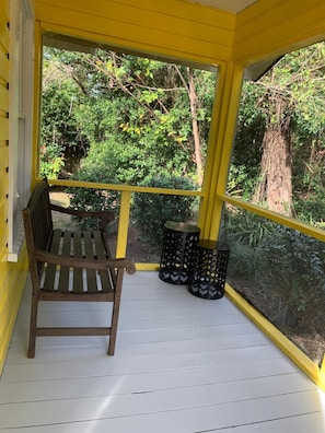 The screened in front porch where you can sip your morning coffee or tea. 