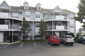 Front of our building, top floor right set of stairs left balcony in that set.