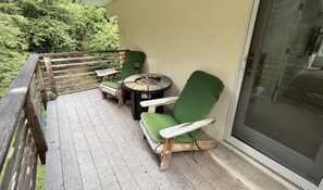 Deck has two Adirondack chairs, a firepit & BBQ.