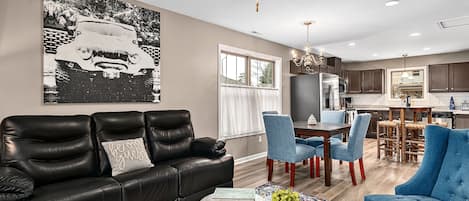 Upstairs living area with reclining sofa.
