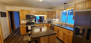 Kitchen with island and a pass-thru to Dining Rm