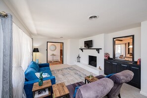 sitting area with fireplace and futon