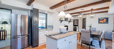 Enjoy a meal with loved ones in this spacious and bright kitchen/dining room!