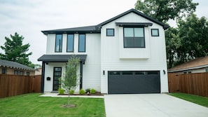 Brand new contemporary home with manicured landscape in trendy West Dallas.