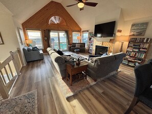 Bright open layout. 65 in flat screen TV, DVD player, Bose radio.