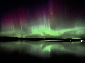 Experience the Northern Lights at Sunset in the Pines