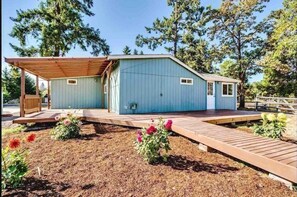 Hang under the covered patio with comfortable outdoor furniture.