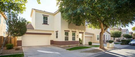 View from the left showing garage and driveway