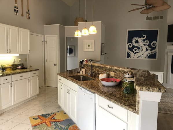 Large open kitchen with bar seats 