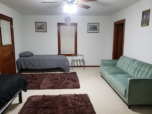 A second Living room with two twin beds, and a couch that folds into a bed