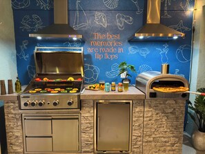Smell the pizza cooking while you float in the pool!
