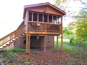 Covered deck with beautiful views of nature as you soak in the hottub.