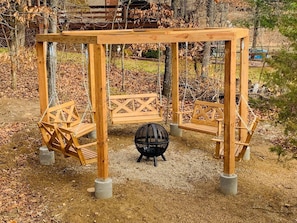 Unique pergola with 5 swings. Perfect for evening fires or enjoying lake views!