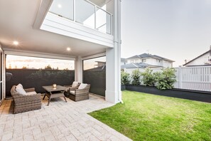 The undercover patio is enclosed with café-style blinds for year-round comfort.