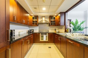 Gourmet Kitchen: Whip up culinary delights with sleek finishes and top-notch appliances!