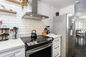 Full kitchen with stainless steel appliances, popcorn machine & pancake maker. 