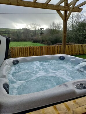 6 Seater hot tub with views across the valley.