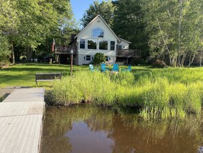 Lakeside - our house with dock and fire pit and comfy Adirondack chairs.