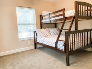 Full size bottom bunk with a twin on the top. 