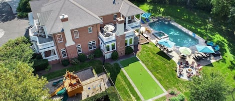 Overhead view of the Long Lane Estate with Swimming Pool, Hot Tub, Golf Putting Green, Fire pit, Pirate Ship Playground, Lounging Chairs & More!