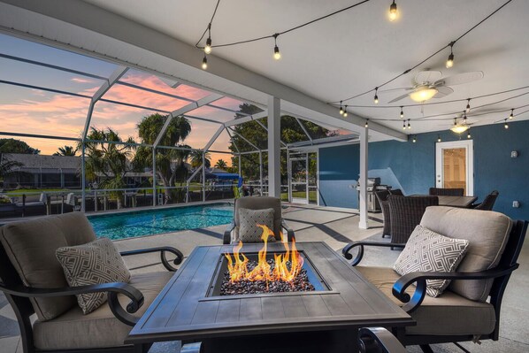 Enjoy this fabulous firepit on the huge, covered lanai at your own private pool.