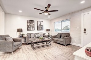 Modern fully renovated great room design with 70" TV.