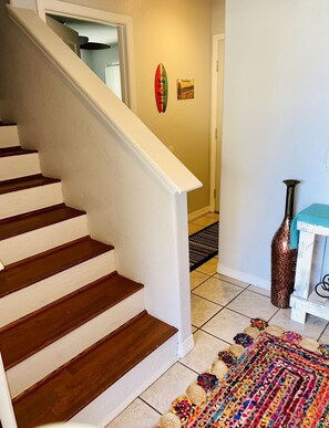 Entry way with downstairs bedroom/bathroom and stairs