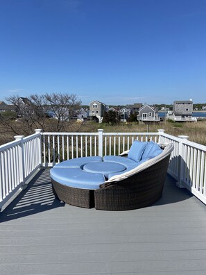 Other end of upper deck, views of lighthouse, harbor, Sand Hills.