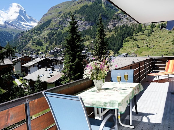 Sky, Mountain, Table, Property, Building, Plant, Flowerpot, Flower, Nature, Green