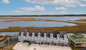 Lighthouse Pointe is the 3rd home from the left.