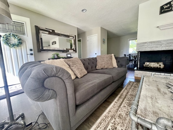 Comfortable living room space with huge smart TV!