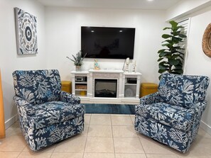 Electric fireplace underneath 65” Smart tv