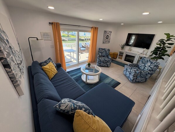 Main living area: 65” Smart TV with cable/streaming capabilities; large deck