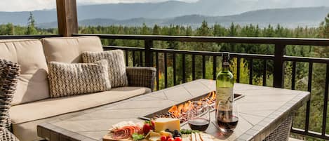 Expansive views, a fire feature, a glass of wine, and a charcuterie board. Ahhhh…..