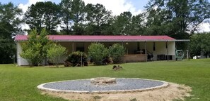 Large fire pit area in the back yard.