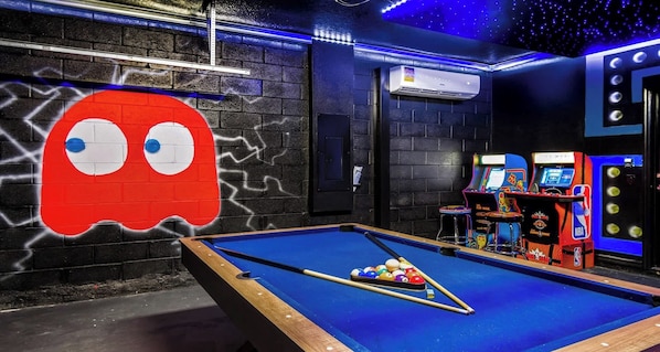 Retro arcade dream with pool table, neon lights, and classic game vibes!