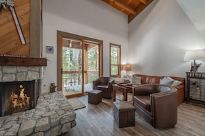 Large Family Room With Deck and Wood Fireplace