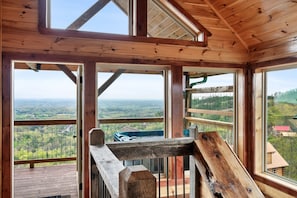 Upper level with access to the hot tub.