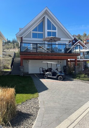 Exterior with large driveway (golf cart available to rent privately)